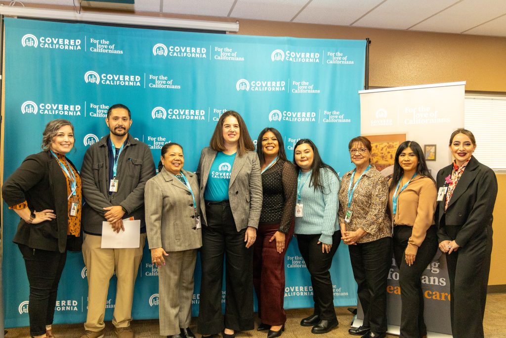 Jessica Altman, CEO of Covered California (center), posing alongside Clinica Sierra Vista's Health Insurance Assistance Team and Chief Administrative Officer, Magdalena Pruitt (far right).
